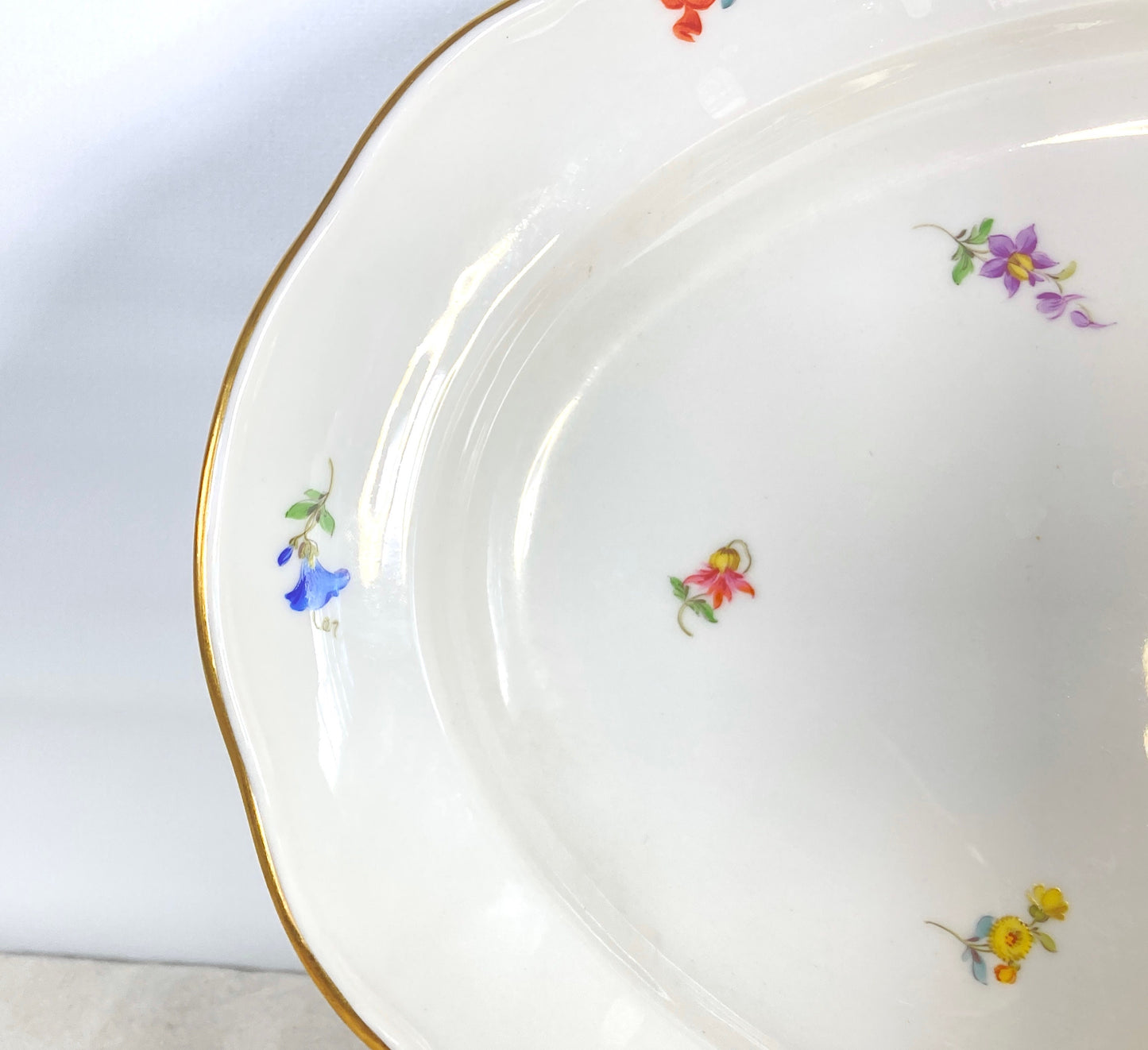 large Meissen oval platter decorated with scattered flowers and gilt rim, 16.5 inches x 12 inches, 1950s