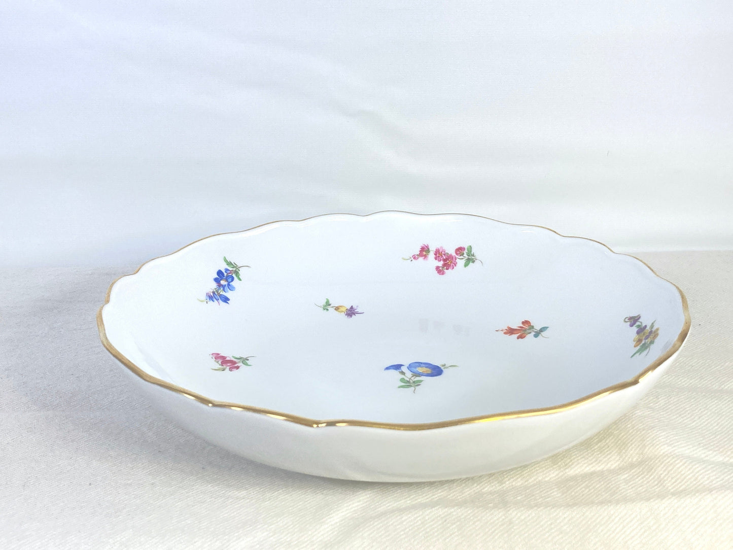 1920s Meissen round bowl, 9.75 inches, decorated with scattered flowers and gilt rim, 1st quality, excellent condition