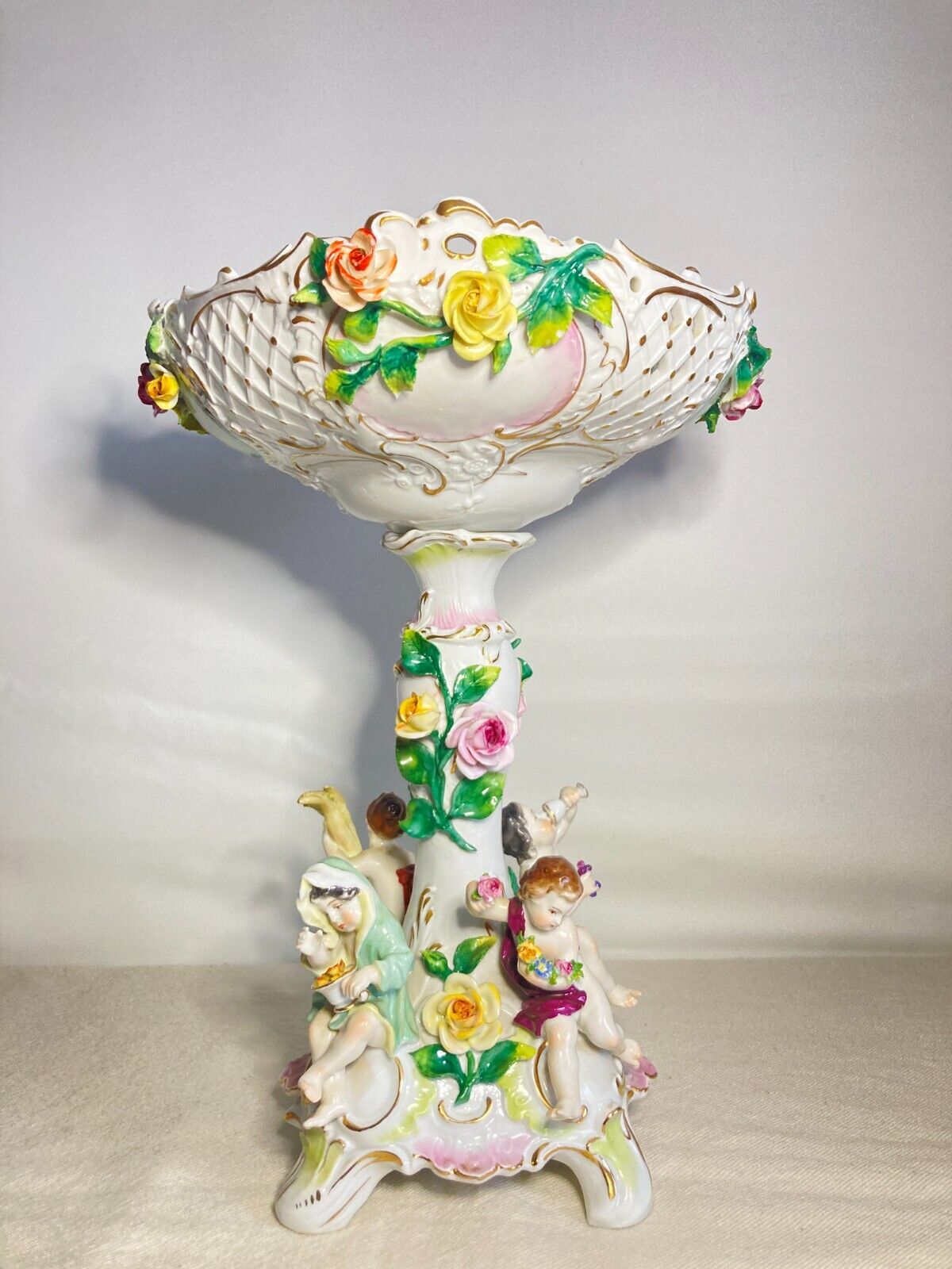 C.1915Germany Volkstedt Dresden porcelain floral encrusted Figural centerpiece.