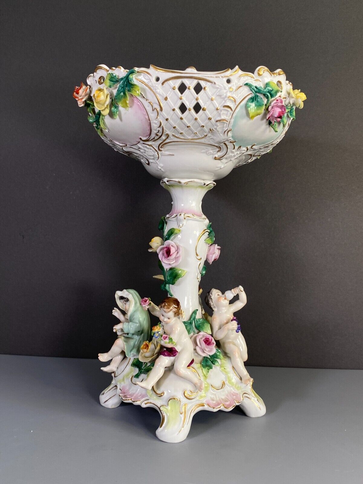 C.1915Germany Volkstedt Dresden porcelain floral encrusted Figural centerpiece.