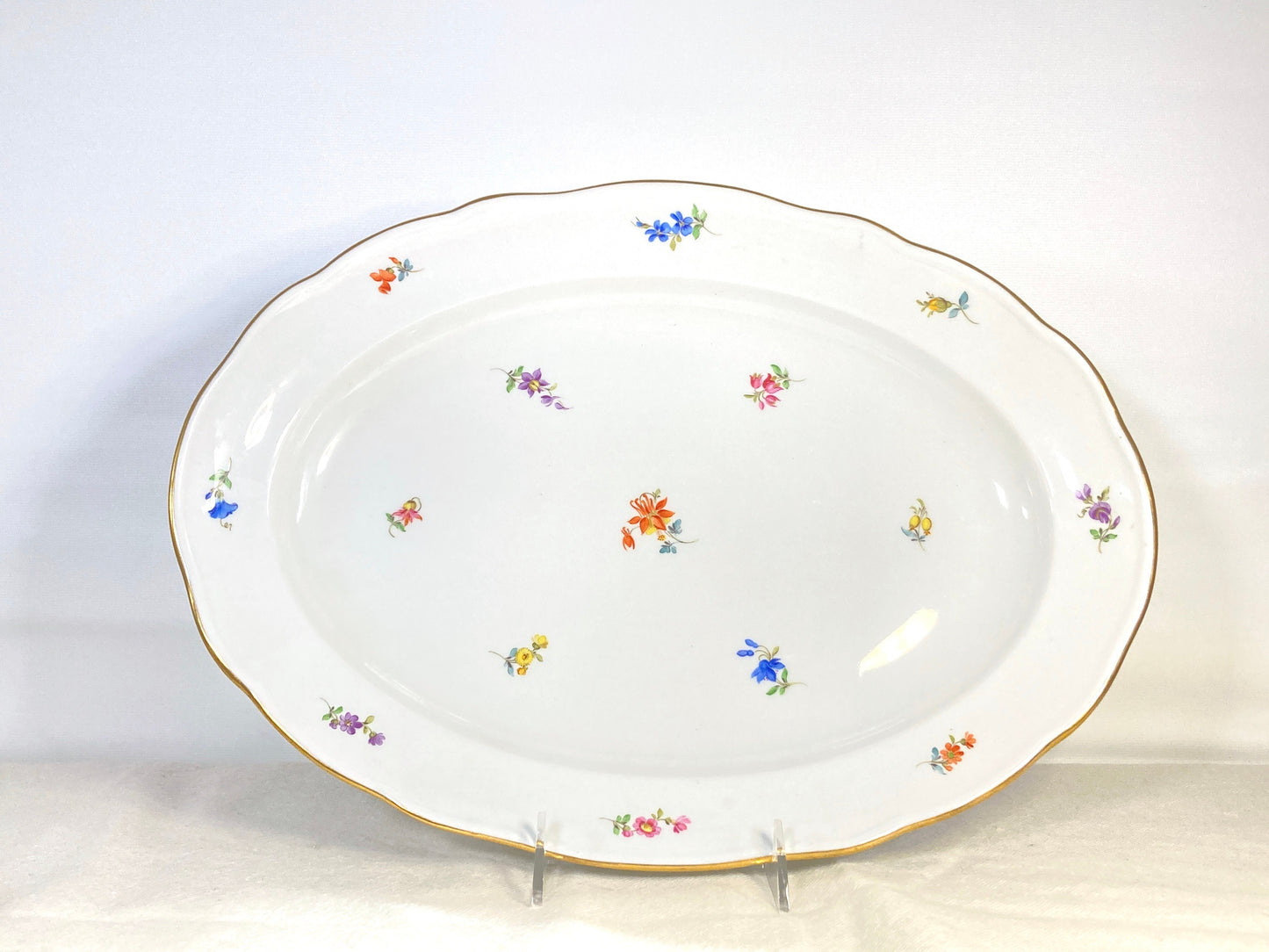 large Meissen oval platter decorated with scattered flowers and gilt rim, 16.5 inches x 12 inches, 1950s