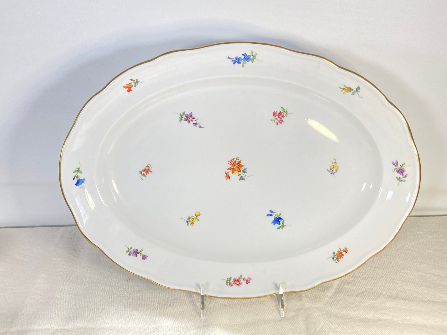 large Meissen oval platter decorated with scattered flowers and gilt rim, 16.5 inches x 12 inches, 1950s