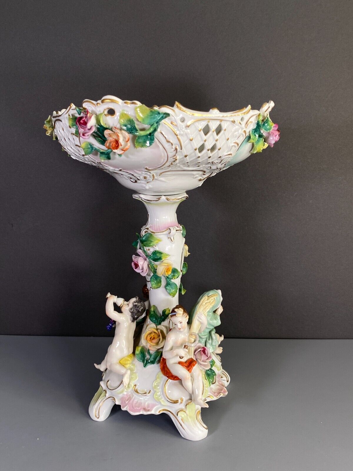 C.1915Germany Volkstedt Dresden porcelain floral encrusted Figural centerpiece.