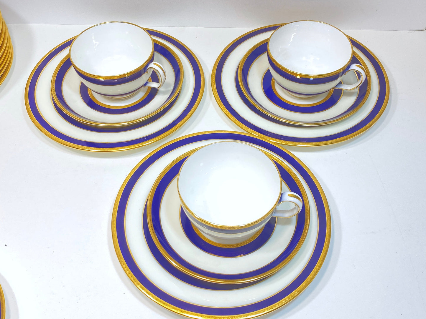 Set of 12 (35pcs) Tiffany & Co Mintons bone china teacups and plats, blue band and gold decoration, ca. 1900, stunning